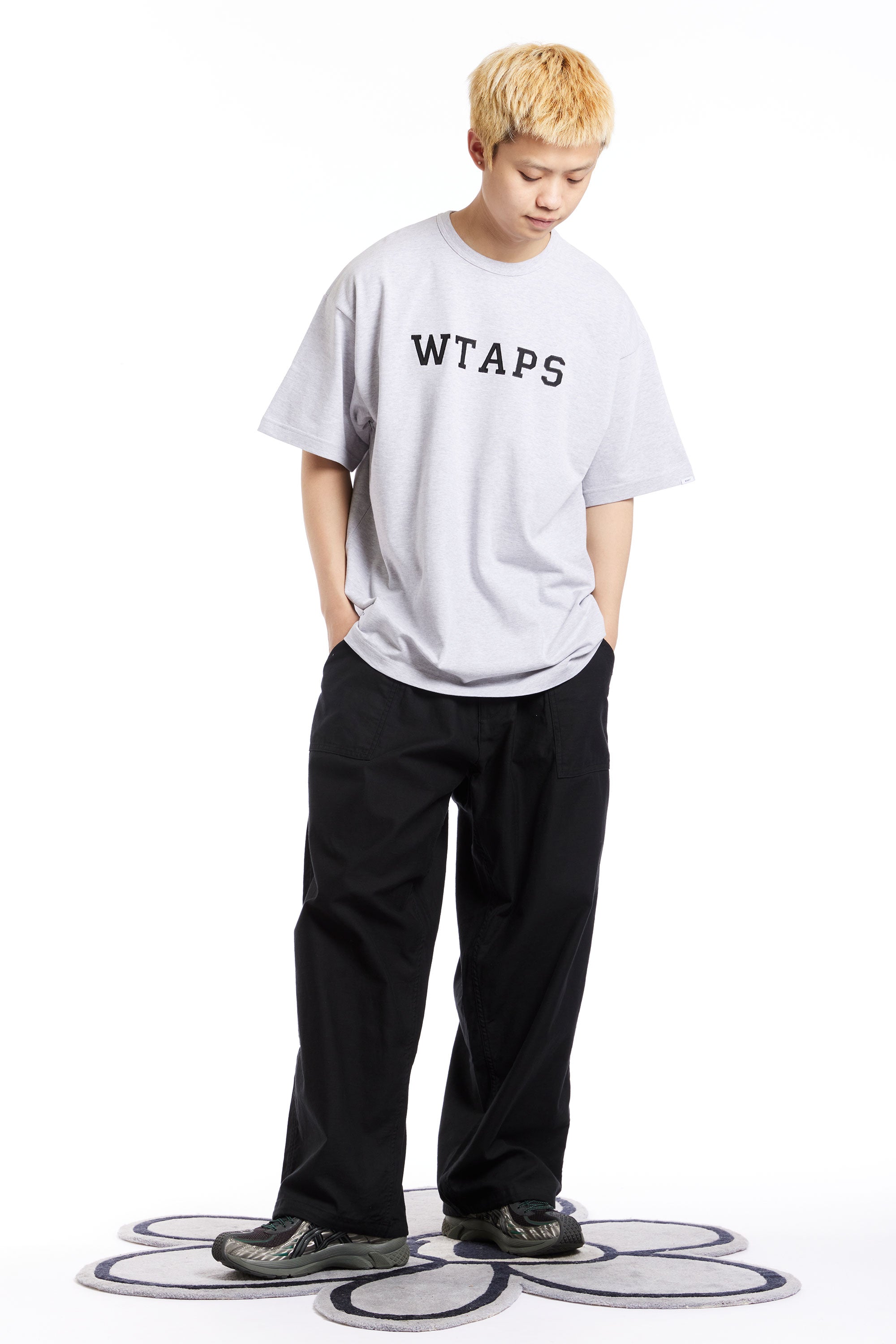 The WTAPS - ACADEMY APPLIQUE SS COLLEGE TEE SS24 ASH GREY available online with global shipping, and in PAM Stores Melbourne and Sydney.