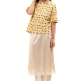 The GIRL BABY YELLOW POLO SHIRT available online with global shipping, and in PAM Stores Melbourne and Sydney.