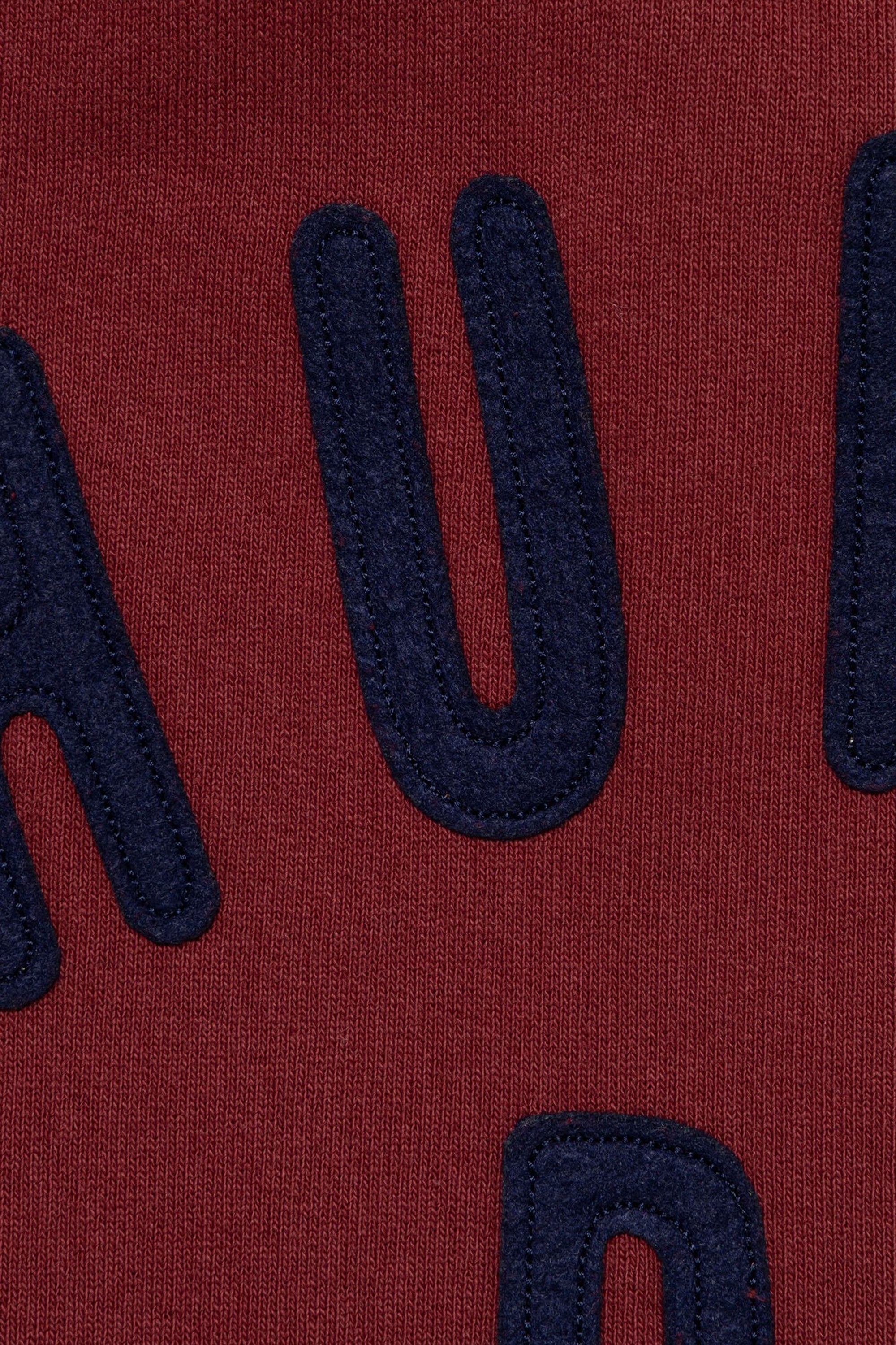 The ZIP-UP SWEATSHIRT BURGUNDY available online with global shipping, and in PAM Stores Melbourne and Sydney.
