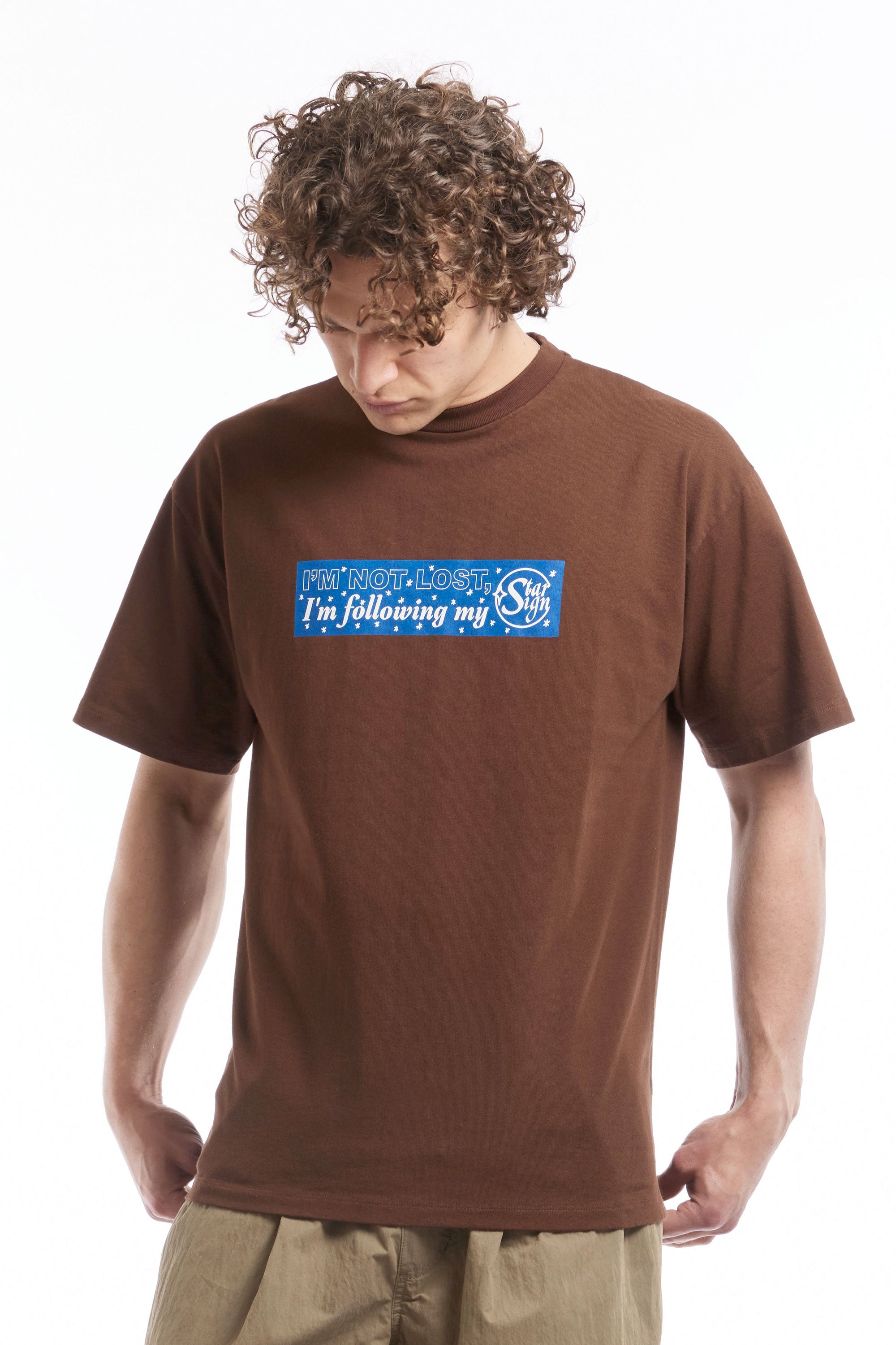 The FOLLOW YOUR STARSIGN SS TEE BROWN  available online with global shipping, and in PAM Stores Melbourne and Sydney.